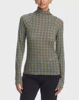 Rag & Bone black shaw paneled turtleneck sweater and pants, modern styling against a plain white background.