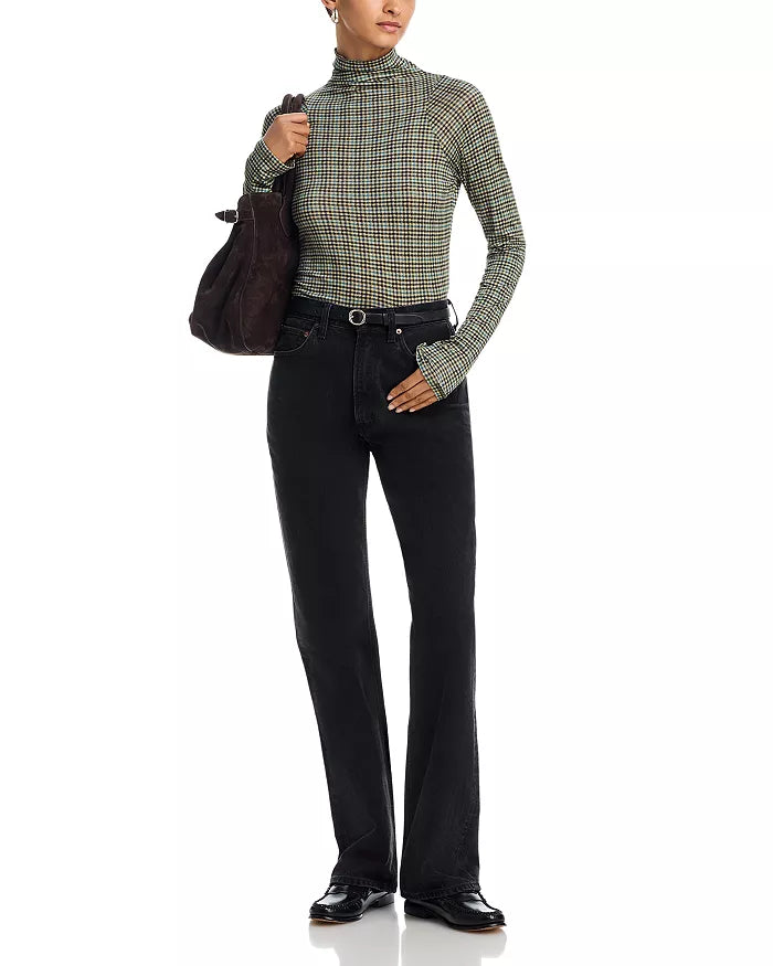 Rag &amp; Bone black shawl-paneled turtleneck with matching jeans and accessories, styled against a white backdrop.