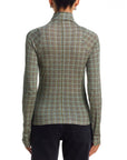 Black Rag & Bone long sleeve paneled turtleneck with black jeans, back view, against white background.