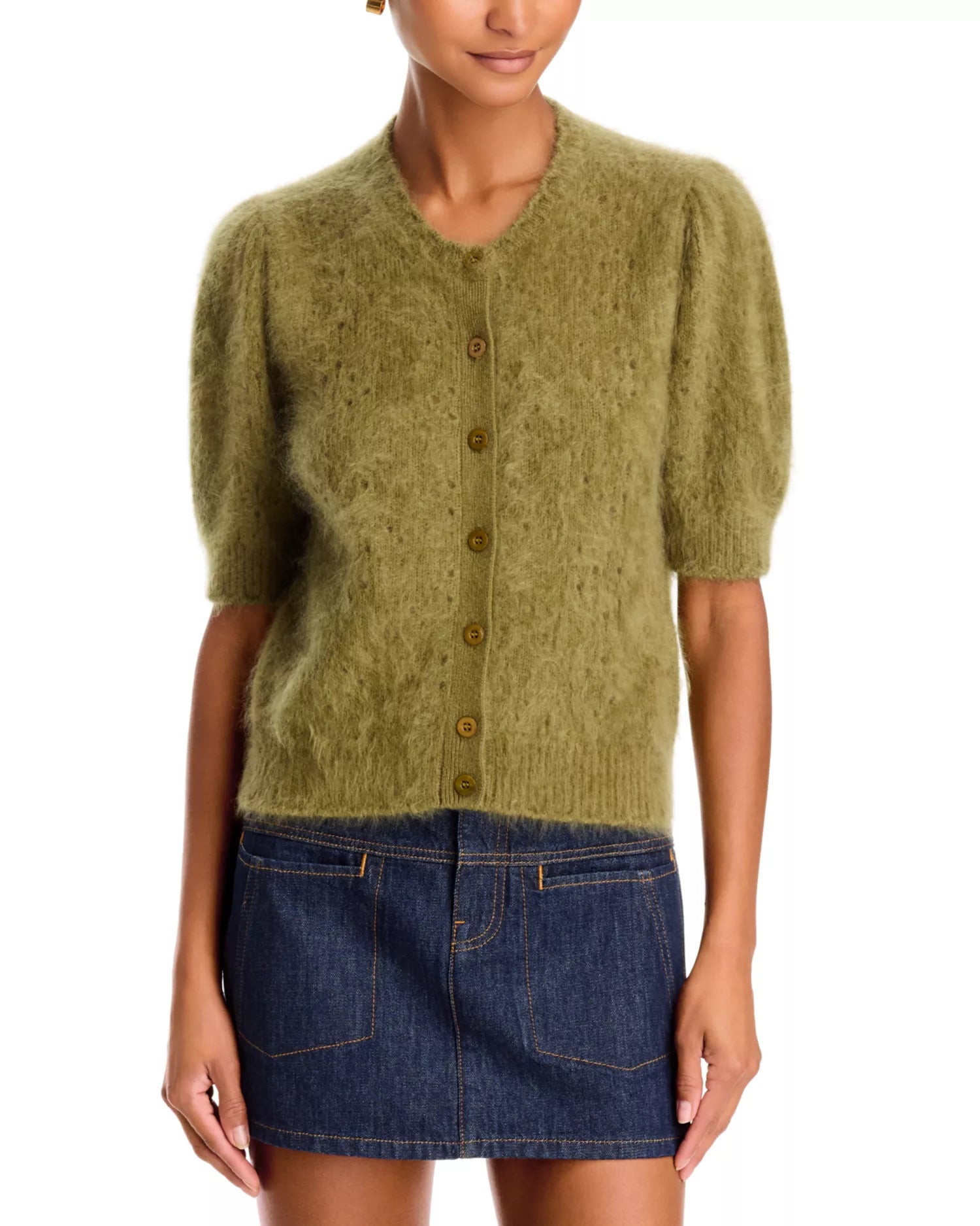 Olive green cropped cashmere cardigan by FRAME styled with a dark blue denim mini skirt, shown waist down.