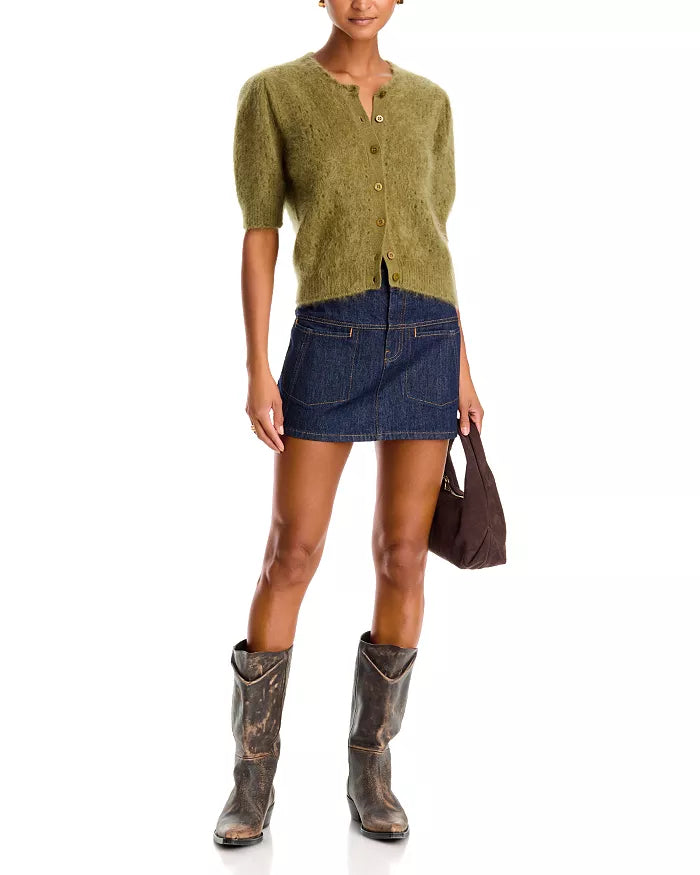 Cashmere Airy Cardi by FRAME styled with a denim mini skirt, tall brown boots, and dark brown handbag.
