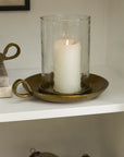 White candle in glass holder on bronze tray by Accent Decor, Winter Warmth Candle Holder, perfect holiday accent piece.