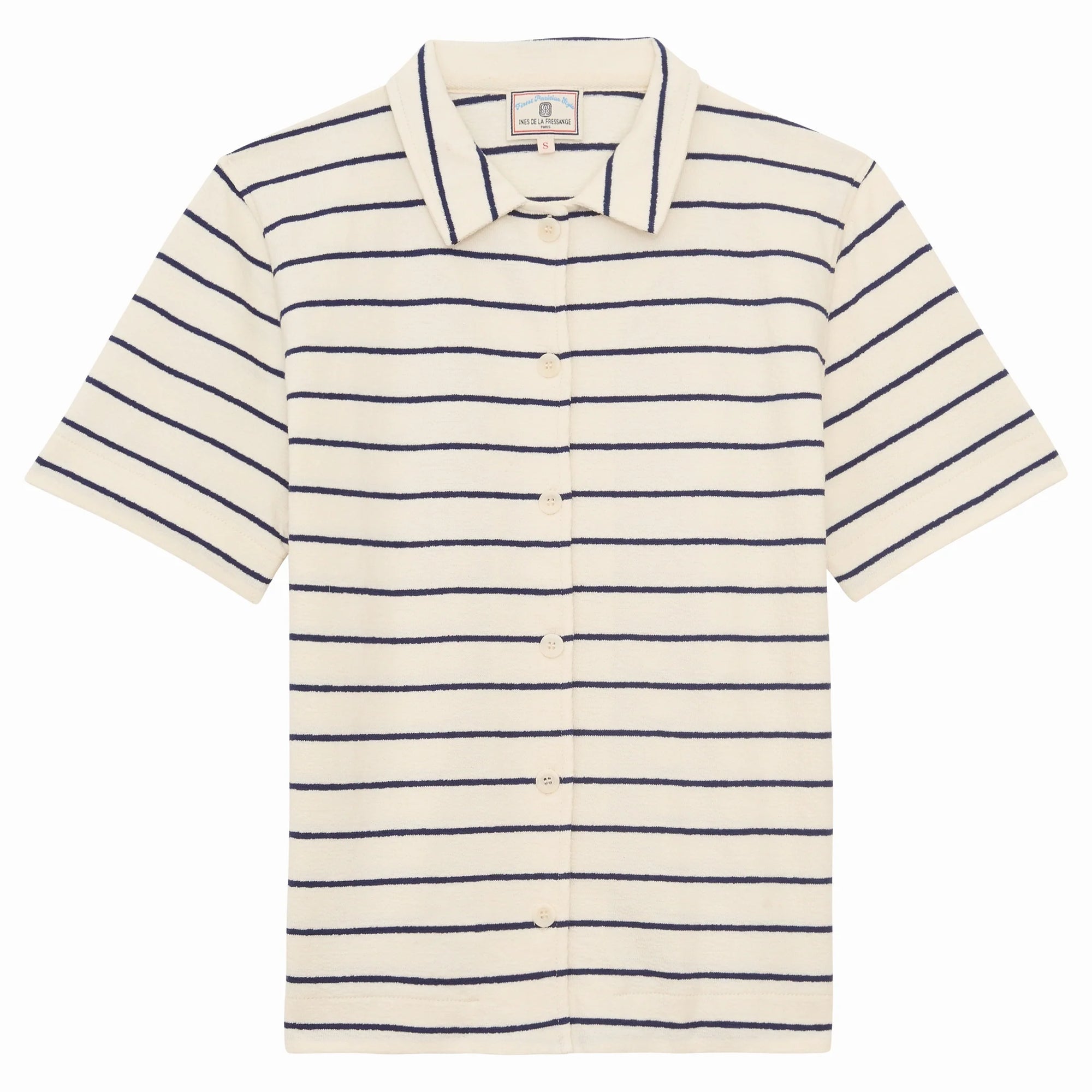 The Nicia Shirt by Ines De LA Fressange is a short-sleeve cream button-front shirt with a collar, featuring horizontal navy blue stripes and inspired by effortless Parisian style.