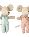 Maileg Baby Twins Matchbox by Maileg features two smiling twin mice with big ears, one in a blue star outfit and one in pink with orange dots. Both have beige fabric bodies and come ready for bedtime in their cozy matchbox bed.