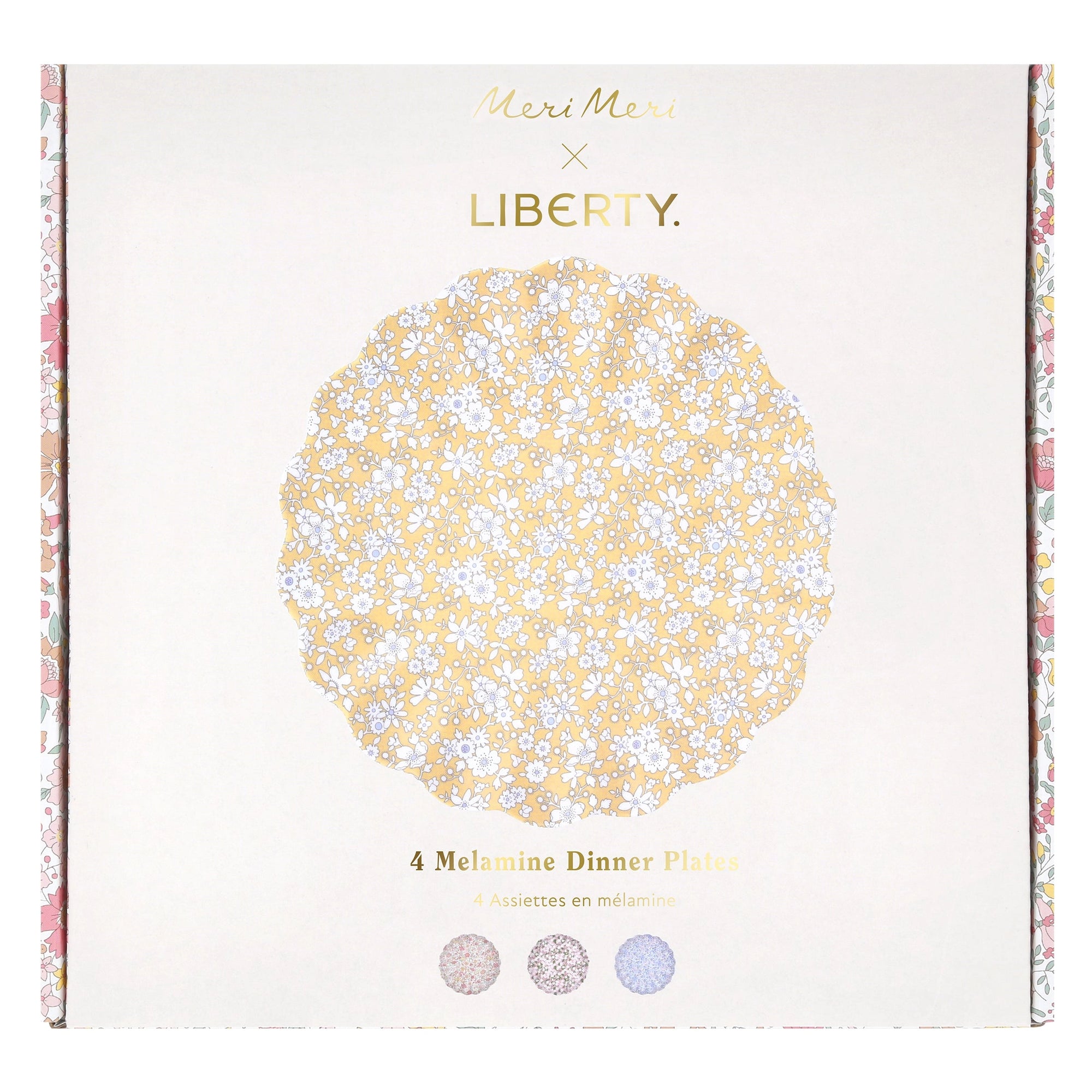 The Faire Mixed Set Reusable Large Plates includes 4 melamine scallop plates in floral and Liberty prints, stored in a “Meri Meri x Liberty” box—great for decorating your next party.