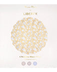 The Faire Mixed Set Reusable Large Plates includes 4 melamine scallop plates in floral and Liberty prints, stored in a “Meri Meri x Liberty” box—great for decorating your next party.