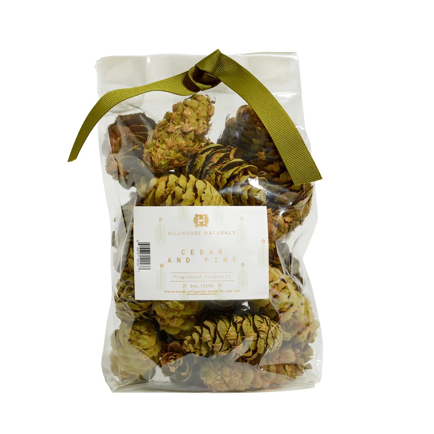 A clear bag of Potpourri Pine Cones by Faire, filled with pine cones scented with cedar and pine, and tied at the top with an olive green ribbon.