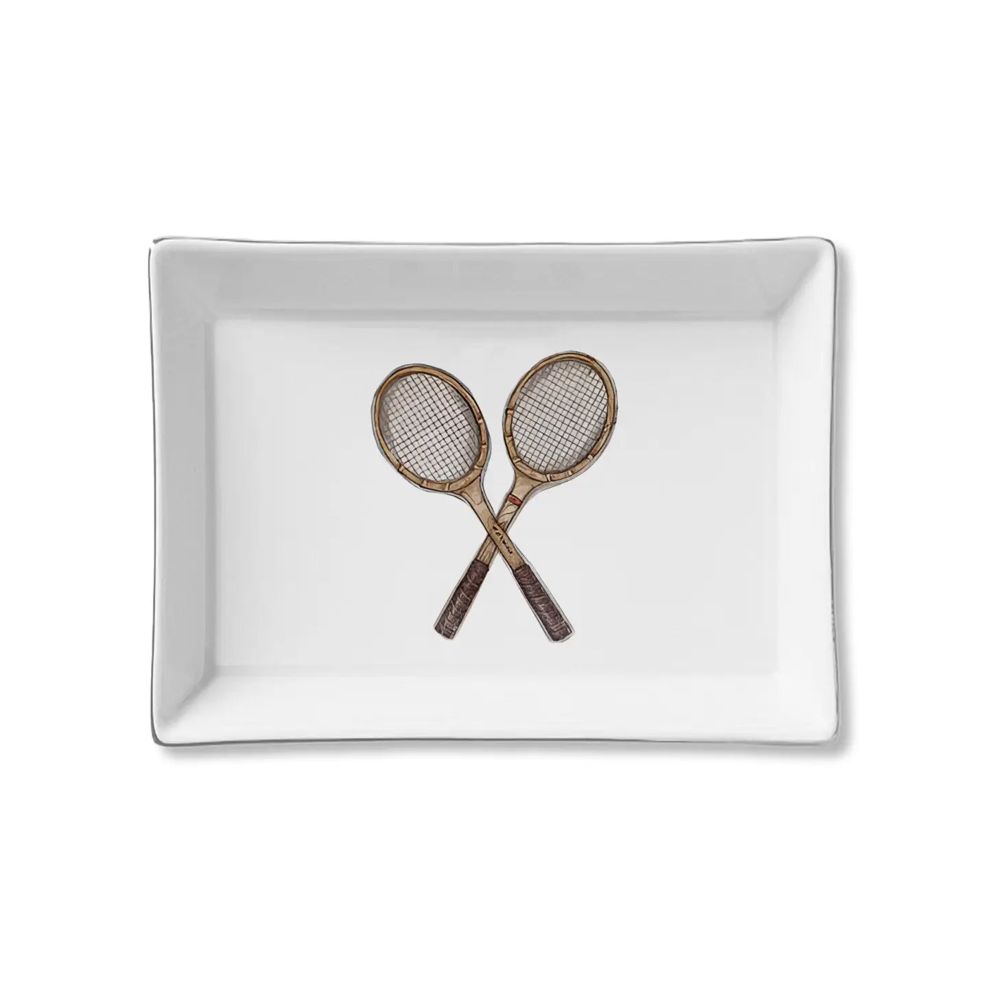 The Faire Ceramic Tray is a rectangular white ceramic piece featuring crossed vintage tennis rackets—ideal for organizing small items or gifting.