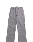 The Indigo Stripe Sailor Pant by Free City (sparrow, LLC) features loose-fitting, straight-leg unisex design with vertical black and white stripes, inspired by classic French sailor pants and shown laid flat on a white background.