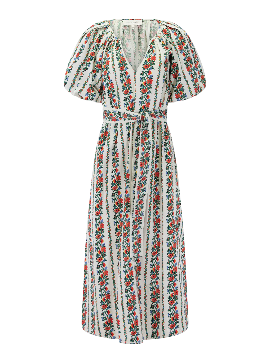 The Great Inc.'s Fairground Dress is a long, short-sleeve pullover with a V-neck, belted waist, and a floral pattern of vertical red and green stripes on white.