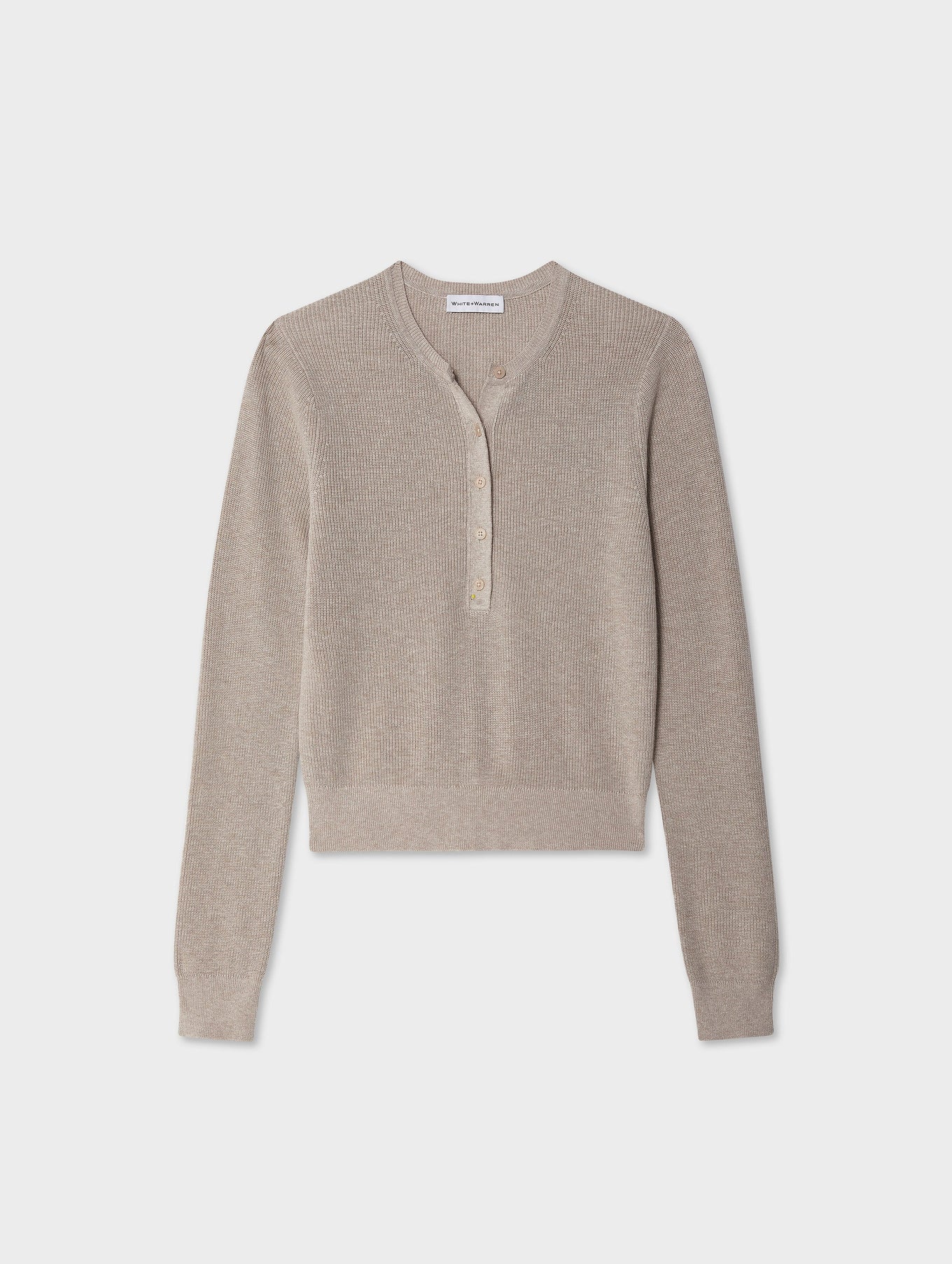 The White + Warren Fine Cotton Blend Henley is a light beige sweater with long sleeves, a round neckline, partial button-front, and ribbed texture. A versatile staple, it's shown on a plain white background.