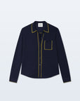 The Cashmere Tipped Button Shirt by White + Warren features a navy menswear design with olive trim on the collar, pocket, placket, and cuffs, plus a single chest pocket and curved hem for timeless style.
