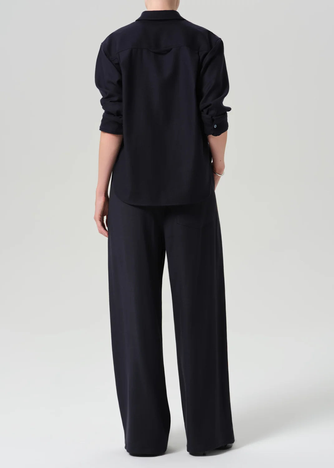 Black button-up shirt with Citizens of Humanity Aurora Portofino Twill pull-on pants, relaxed fit and drawstring waist.