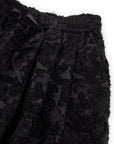 Close-up of Psophia’s Palazzo Wide Leg Trouser, featuring a minimalist design with an elastic waistband, drawstring, and soft, fuzzy fabric.