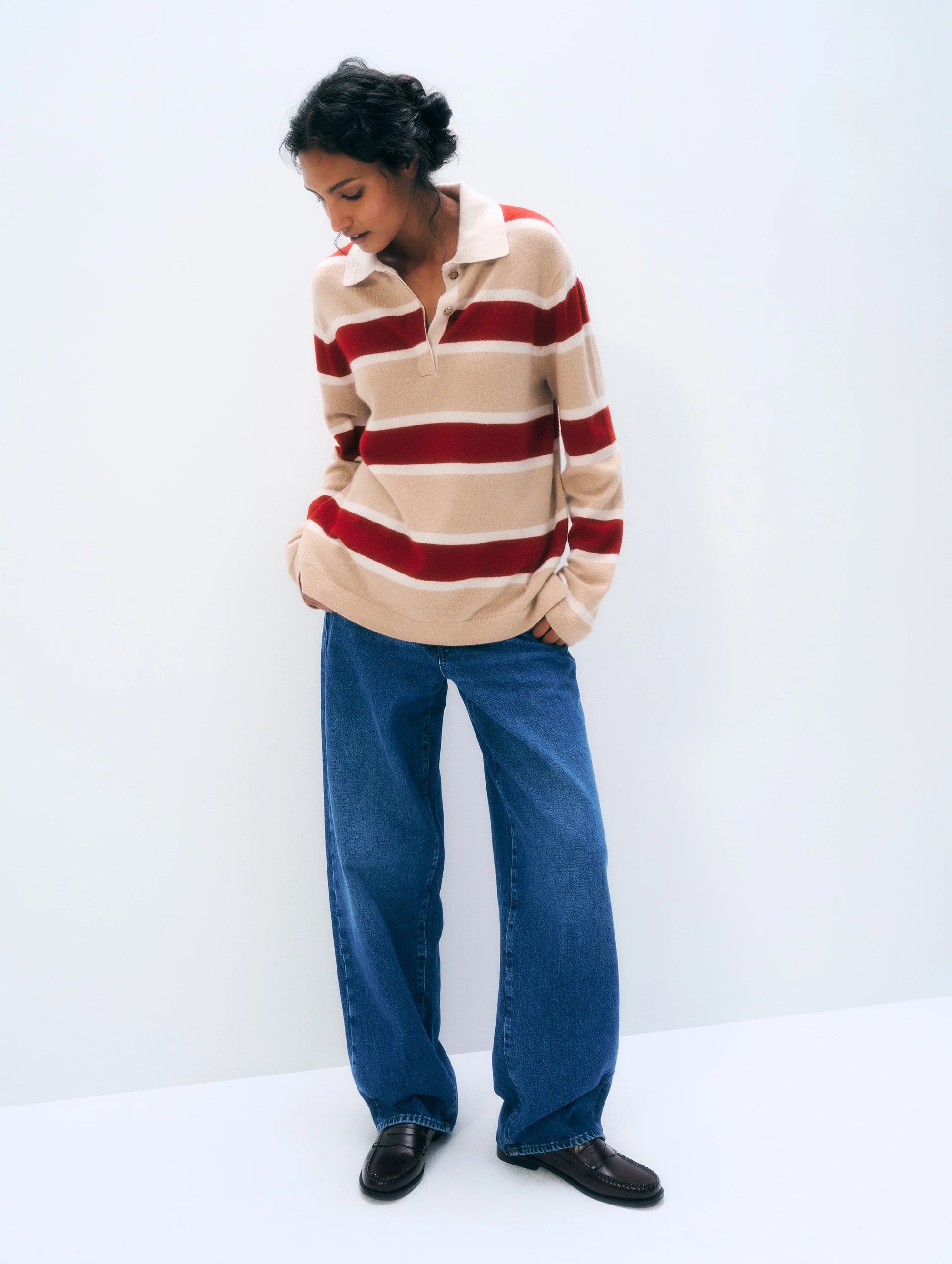 White + Warren Cashmere Rugby Stripe Polo in white with blue stripes, styled casually with wide-leg jeans and loafers.