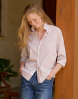 Frank & Eileen relaxed-fit striped cotton shirt in blue, styled casually with jeans by a wooden post.