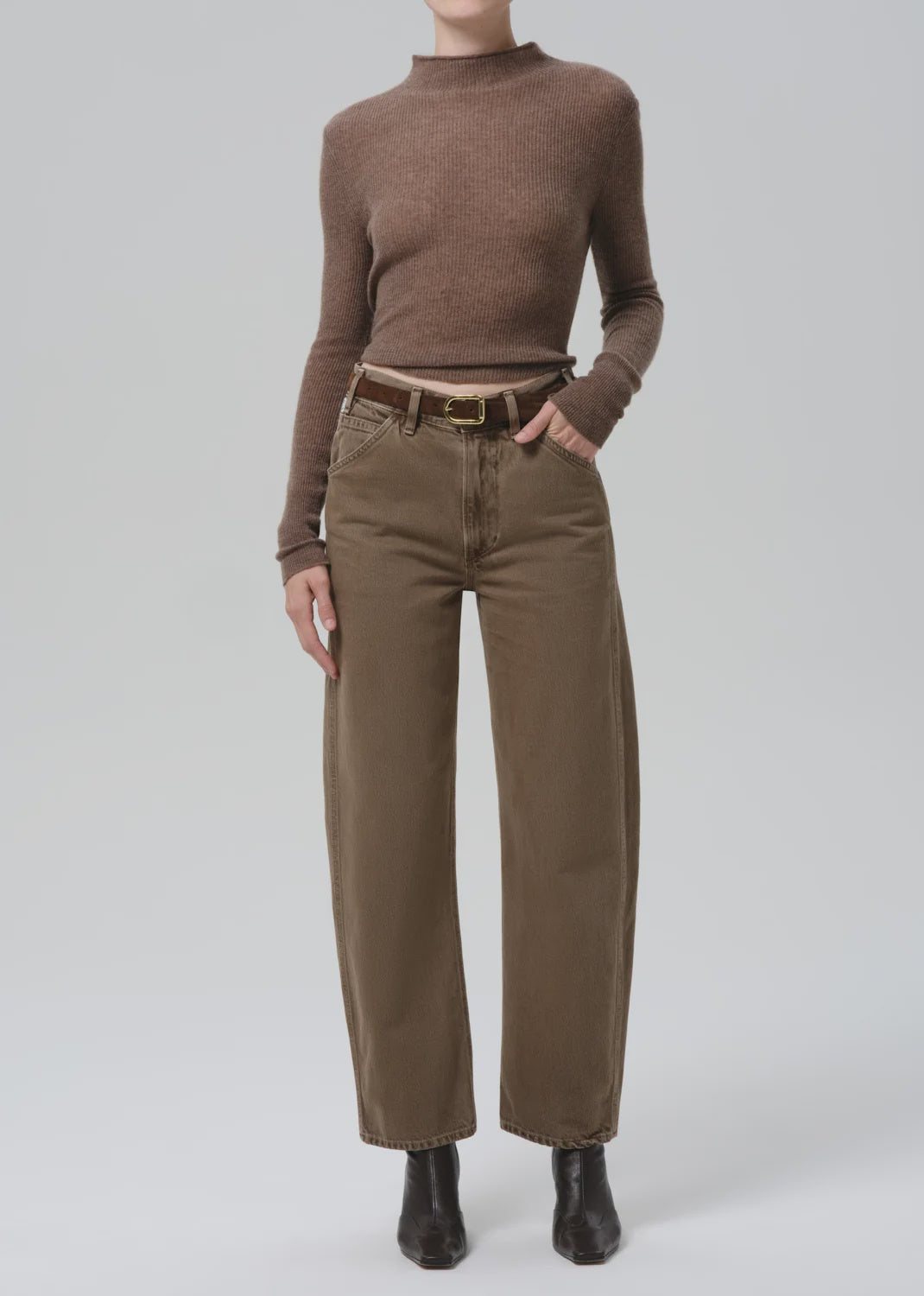 Miro Full Length Deck Pant by Citizens of Humanity, styled with brown sweater and black boots against plain backdrop.