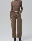 Miro Full Length Deck Pant by Citizens of Humanity, styled with brown sweater and black boots against plain backdrop.