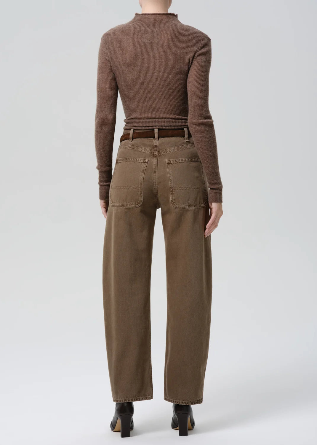 Brown ribbed sweater with Citizens of Humanity Miro Full Length Deck Pant and heeled boots, seen from behind.