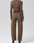Brown ribbed sweater with Citizens of Humanity Miro Full Length Deck Pant and heeled boots, seen from behind.