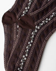 The Faire Vintage Stripe Floral Socks in dark brown feature a textured pattern with vertical light gray diamond shapes and are shown laid flat and overlapping on a white background.