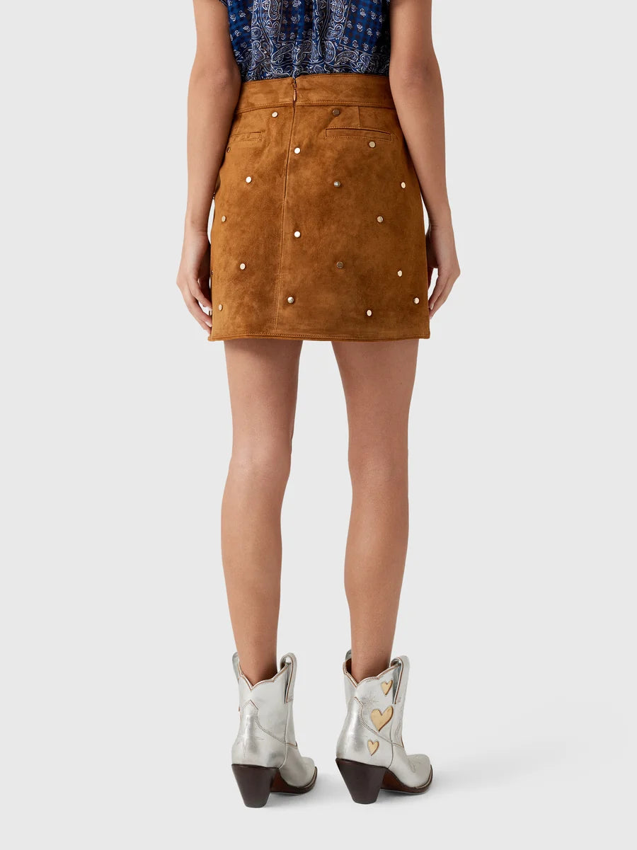 Hunter Bell NYC Dottie Skirt paired with silver studded cowboy boots, shown from the back for a casual chic look.