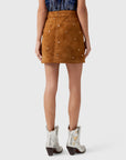 Hunter Bell NYC Dottie Skirt paired with silver studded cowboy boots, shown from the back for a casual chic look.