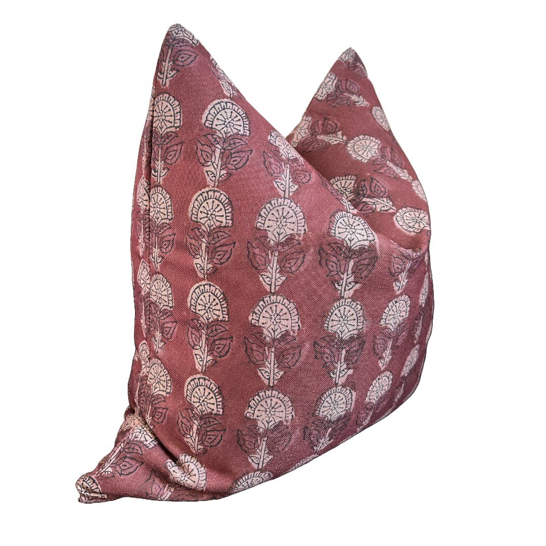 Maroon 22x22″ plush pillow with white floral pattern, pointed corners by Faire Lo at Bungalow Furniture.