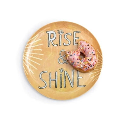 Sugarboo Designs' The Breakfast Club Plate Set features a round plate with "RISE & SHINE" and sun rays, served with a pink frosted sprinkled donut—a true Breakfast Of Champions.