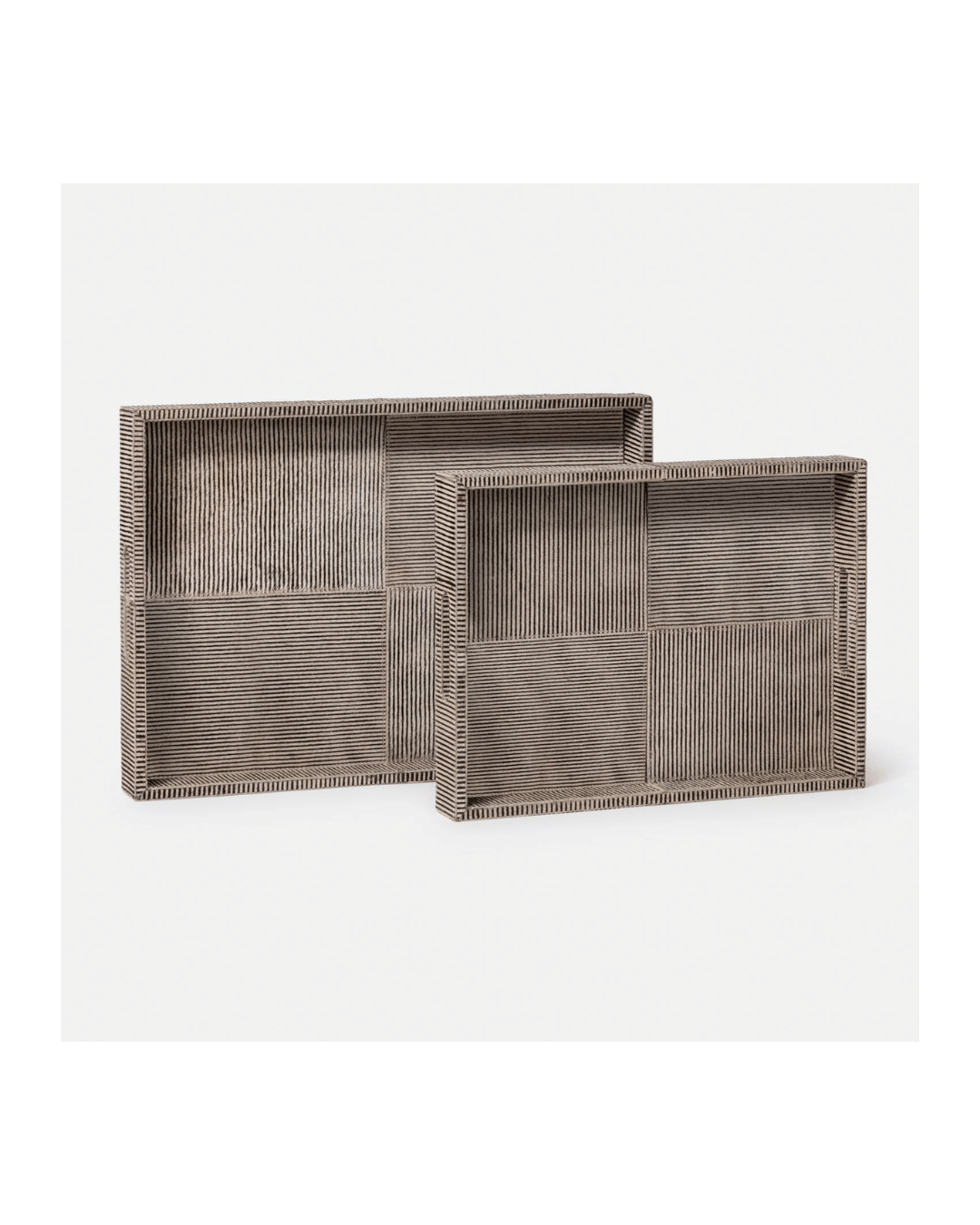 Two Fenmore Trays from Made Goods, featuring an alternating geometric stripe pattern, are placed side by side against a plain white background. With one tray larger than the other, their minimalist rustic design is enhanced by a hair-on-hide finish.