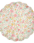 The Faire Mixed Set Reusable Large Plates feature round, scalloped-edge melamine with dense pink, yellow, and orange floral patterns and green leaves on white—perfect as decorative party plates.