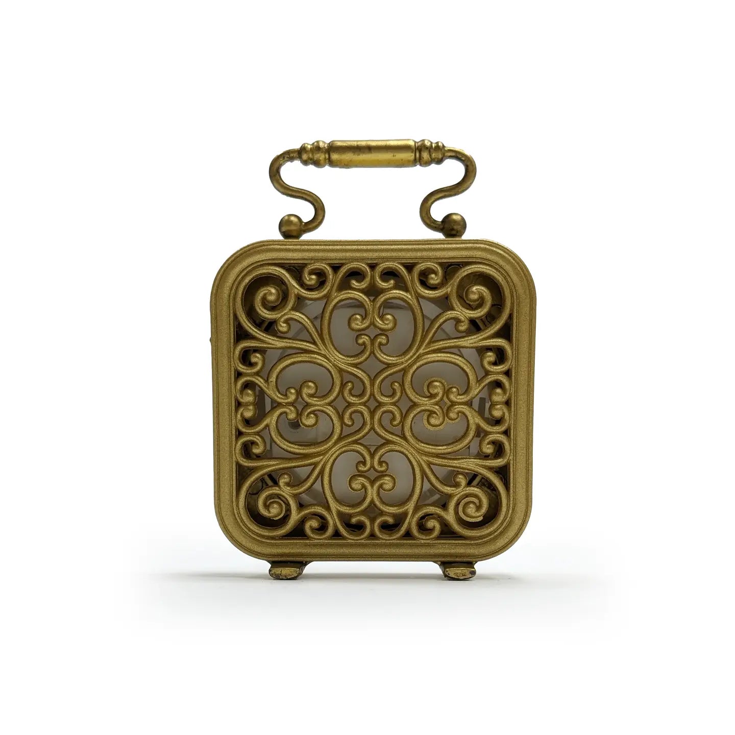 The Zentique Gold Table Clock Pewter features a square, vintage gold tone design with ornate scrollwork, rounded feet, and a curved handle—ideal as a unique accent for modern decor. Displayed against a plain white background.