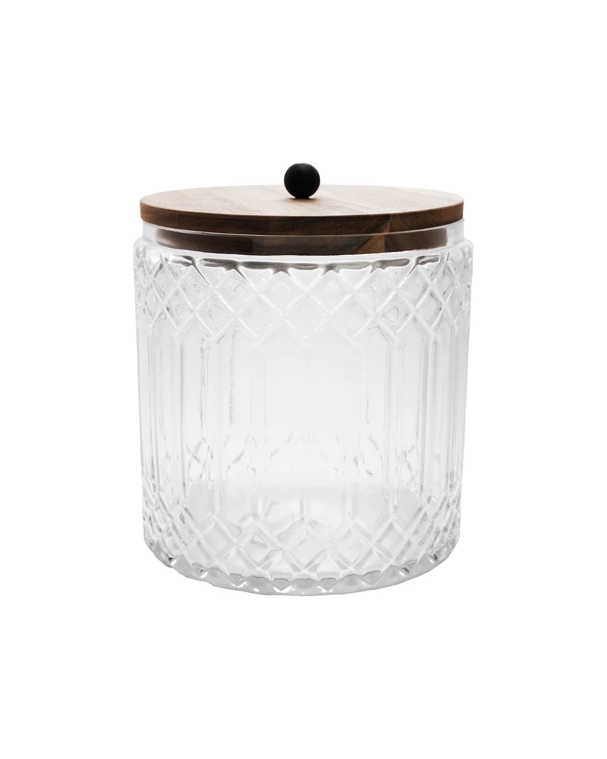 The Creative Co-op Glass Jar Acacia Wood Lid is a 3.5-quart cut glass jar with an intricate geometric pattern and a round, flat acacia wood lid topped by a small black knob, shown against a white background.