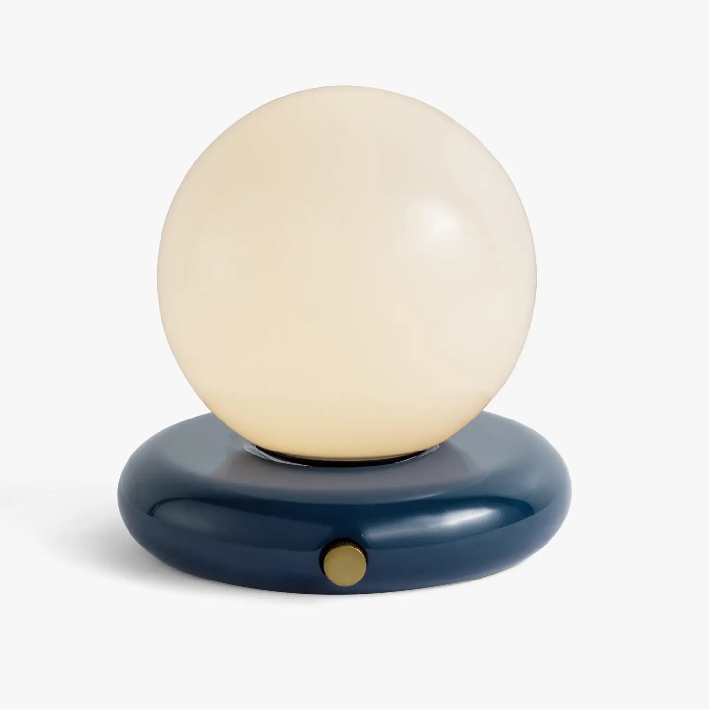 The Valencia Portable Light by Faire features a round frosted white glass globe on a glossy dark blue circular base with a small gold-colored button, offering a sleek and minimalist design.