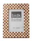The BIDK Home 5x7 Bone/Wood Frame features a brown and white checkered pattern and includes a "bidk home" placeholder image with size details (5x7” | 13x18cm)—a chic touch for elegant decor.