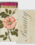 A HomArt decorative matchbox features pink-tipped safety matches with an illustrated rose and "Beauty" in elegant script on the lid, which is partially open to reveal the matches—an ideal hostess gift.