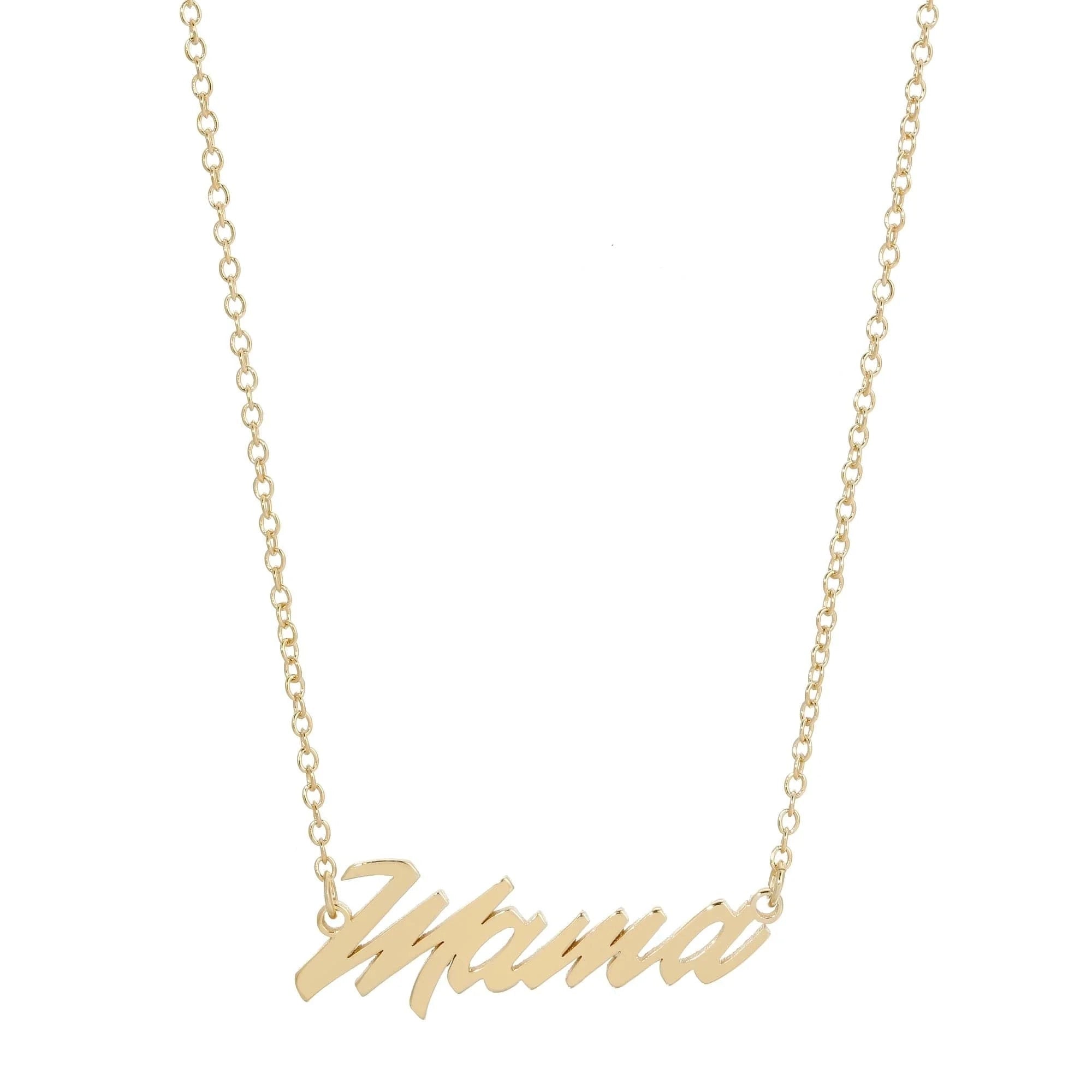 The Faire Script Necklace is a handmade gold chain with a "Mama" cursive pendant, crafted ethically in the USA.