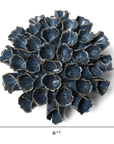 The Sea Polyp Large Blue Grey by Faire is a handmade ceramic piece, shaped like a succulent or artichoke and finished in dark blue-grey. Measuring 6.5" wide by 6.5" tall, it’s perfect as unique boho plant wall decor.