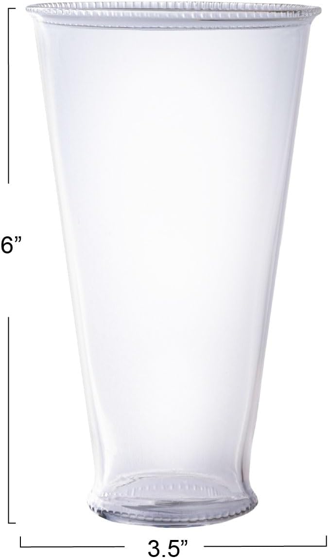 The Creative Co-op Drinking Glass w Debossed Rim features a slightly flared rim, stands 6 inches tall with a 3.5-inch diameter base; each glass is sold individually.
