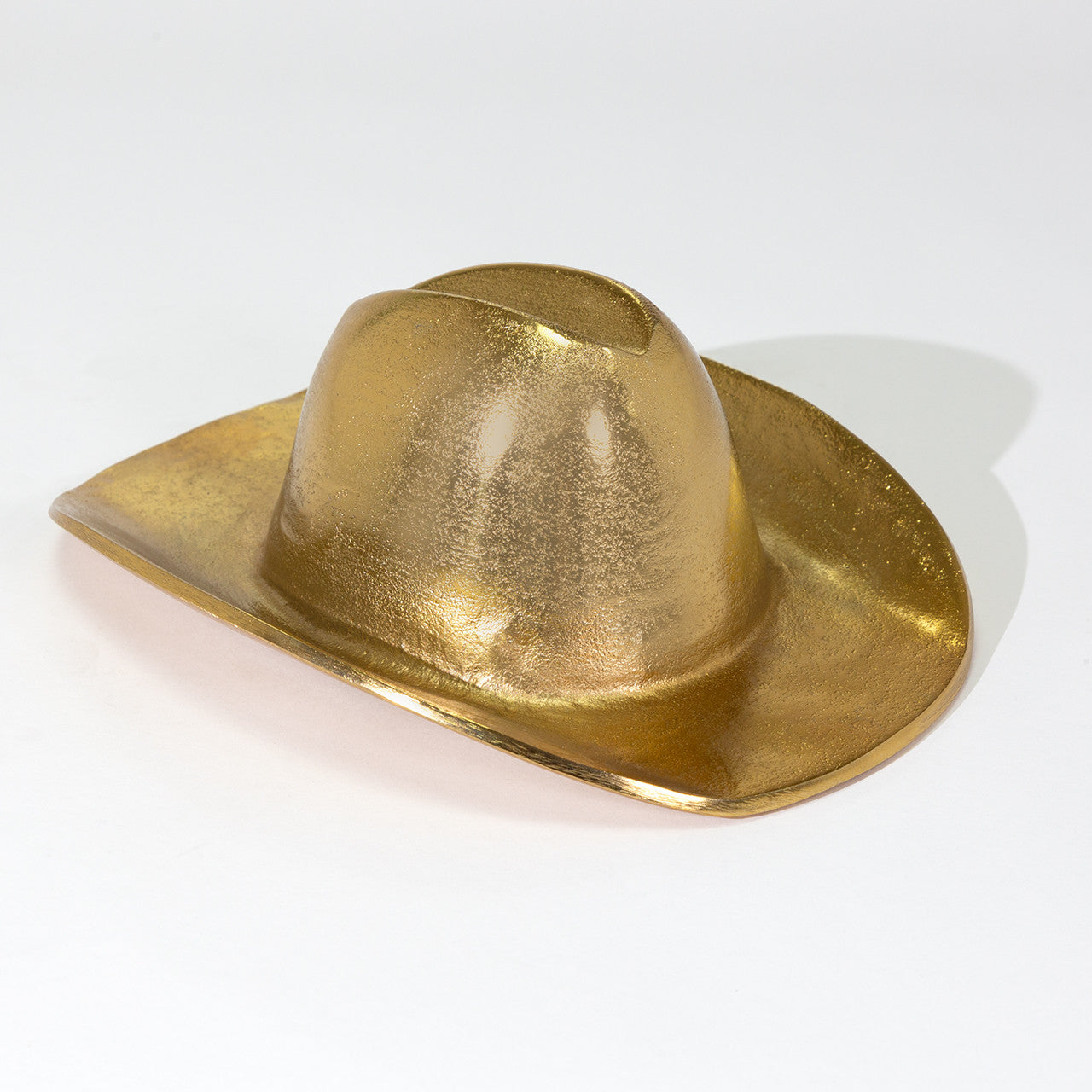 The Import Collection's 44-230 Westin Hat sculpture features a metallic gold finish and classic wide-brimmed western silhouette, displayed against a plain white background for standout appeal.