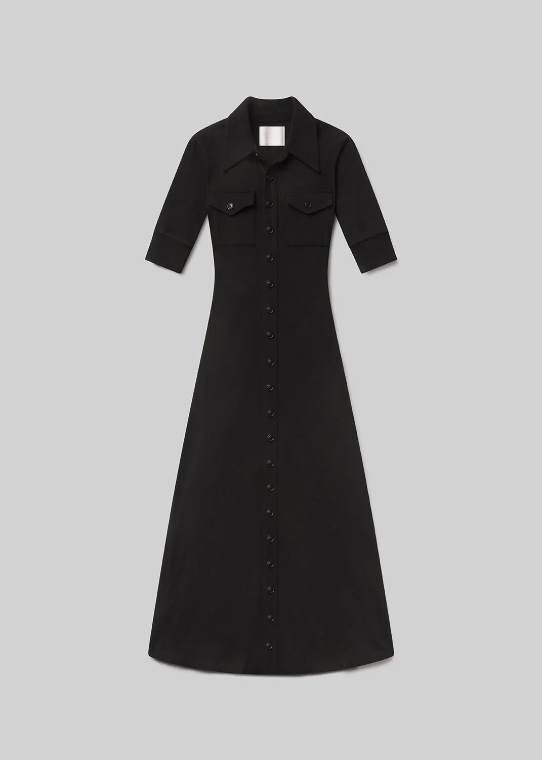 The Amina Polo Dress by Citizens Of Humanity/AGOLDE is a black, collared midi button-down with short sleeves and two chest pockets, shown laid flat on a light gray background.