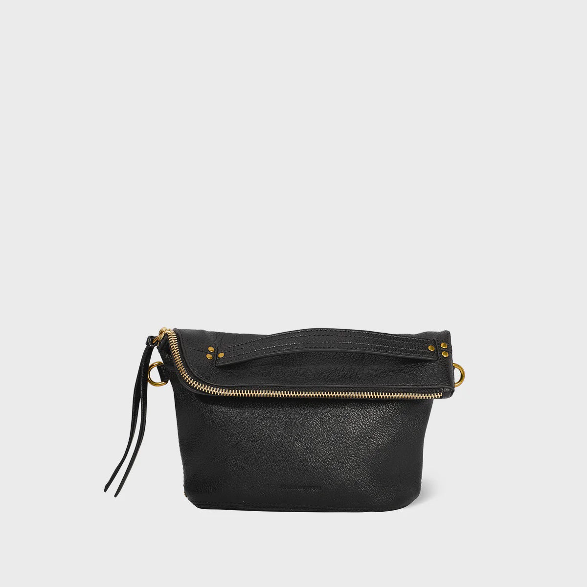 The Lucky Pochette by Jerome Dreyfuss is a black goatskin leather crossbody bag, embellished with gold zippers and hardware. It features a zip closure and a tassel-decorated strap for added elegance, all set against a plain white background.