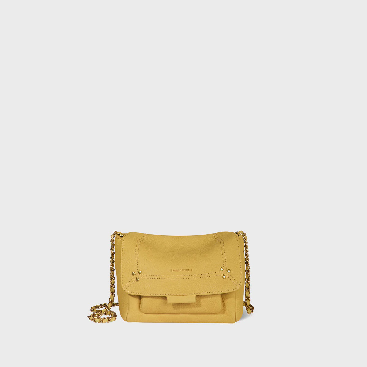 The Lulu Small Bag by Jerome Dreyfuss is a yellow crossbody with subtle stitching, a small top logo, and a sophisticated water-repellent finish. It has a flap closure and a gold leather-and-chain shoulder strap, set against a plain white background.