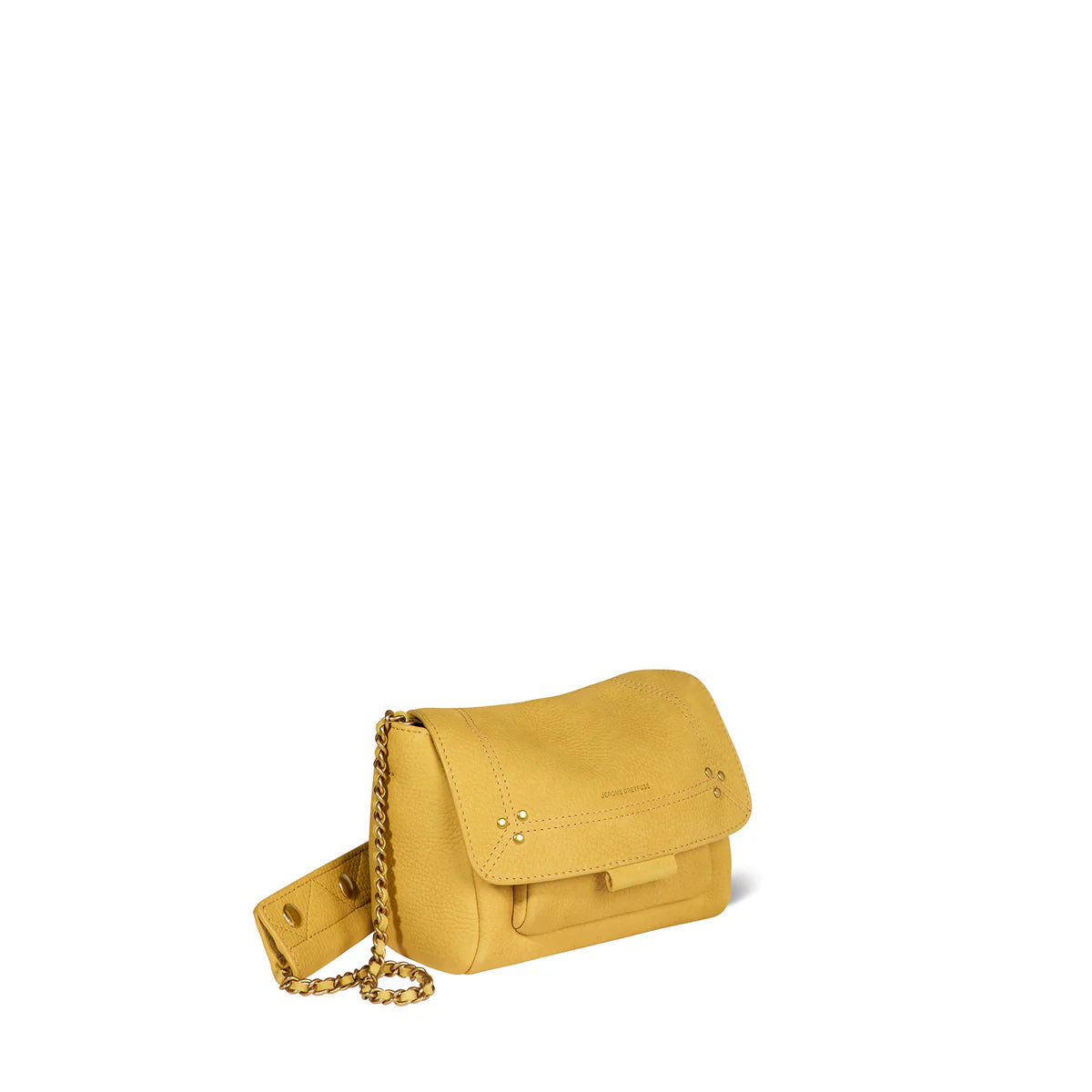 A mustard yellow leather Lulu Small Bag by Jerome Dreyfuss, featuring a flap closure, gold chain cross-body strap, and small decorative studs. The brand is subtly embossed on the flap. Set against a plain white background.