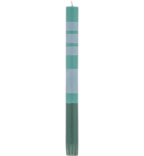 The Striped Beryl Green &amp; Moonstone Candles S/2 by Faire feature tall, slender hand-poured candles with alternating blue and green bands, adding vibrant elegance to any table setting.