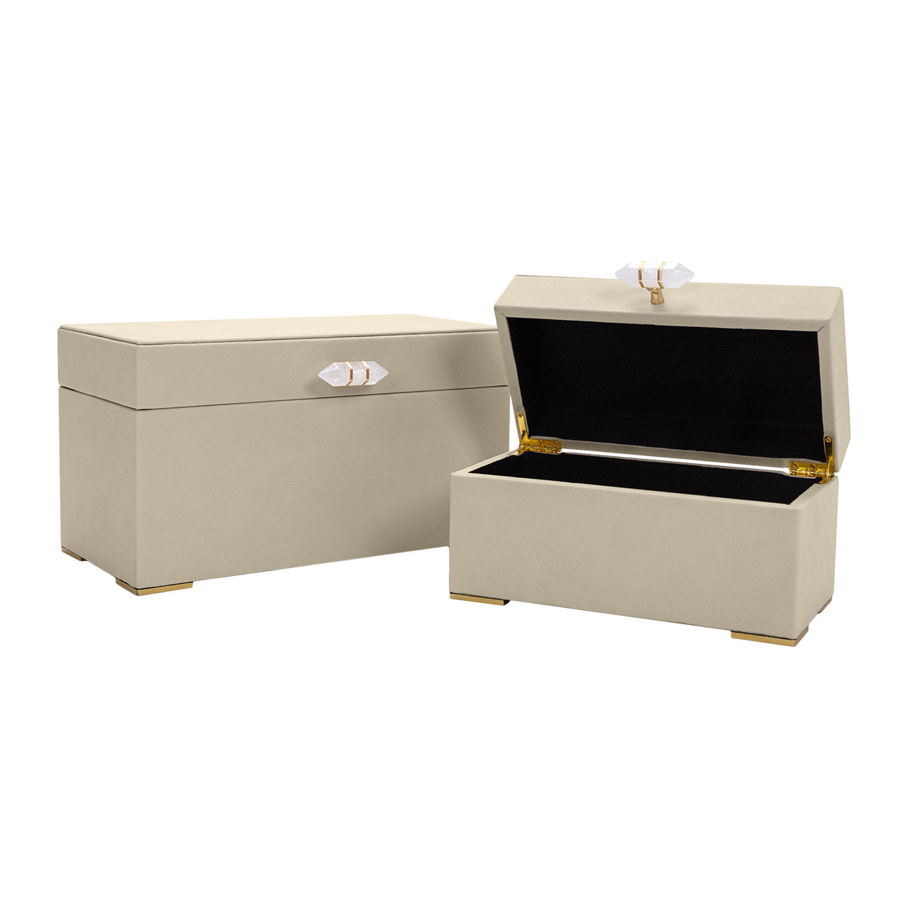 Two Ramato Boxes by The Import Collection in beige with gold feet and crystal handles; one box is closed, the other open to show a sleek black interior.
