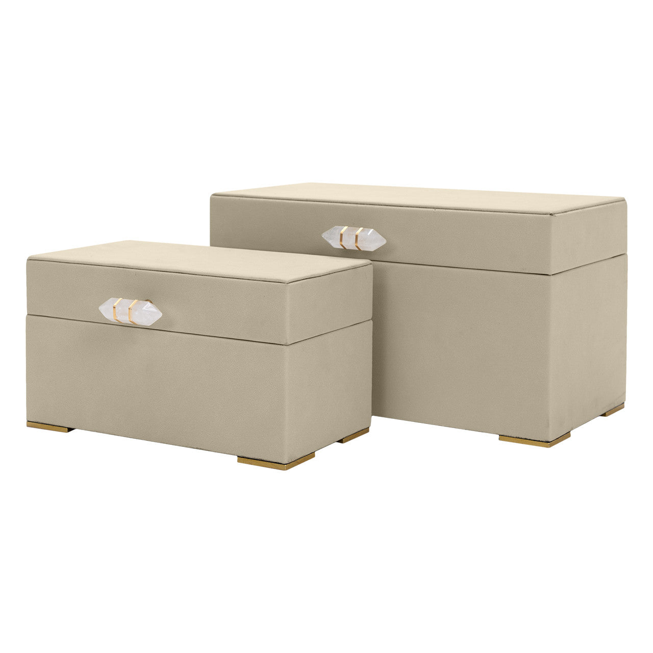 The Import Collection’s Ramato Box set features two beige rectangular fabric storage boxes in different sizes, each with gold-accented crystal handles and small gold feet—a chic accent for modern home decor.