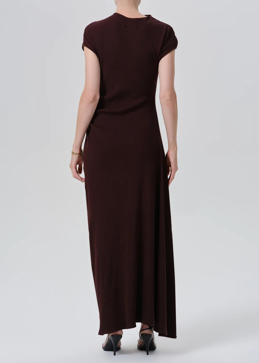 Burgundy kira sculptural maxi dress by Citizens Of Humanity/AGOLDE, shown from the back with heels.