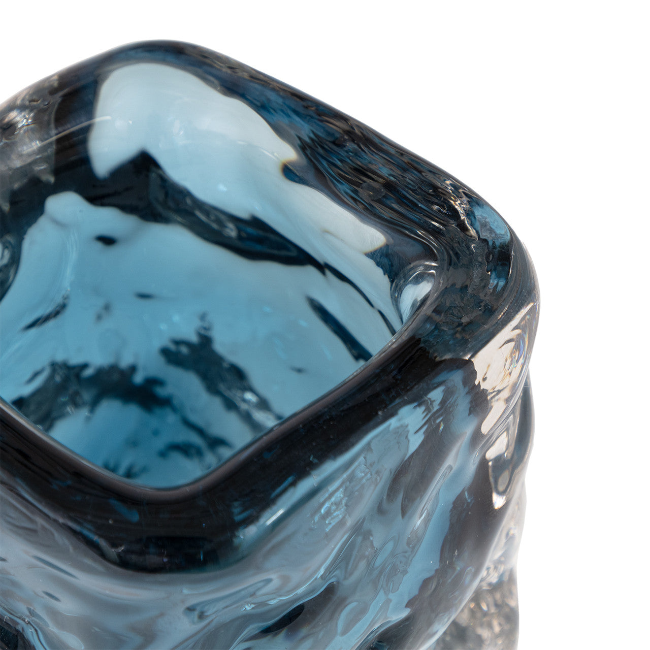 Close-up of the Hendrick vase by The Import Collection—a square-shaped blue glass vase with wavy textured sides and a glossy finish. This elegant decorative piece is shown isolated on a white background.