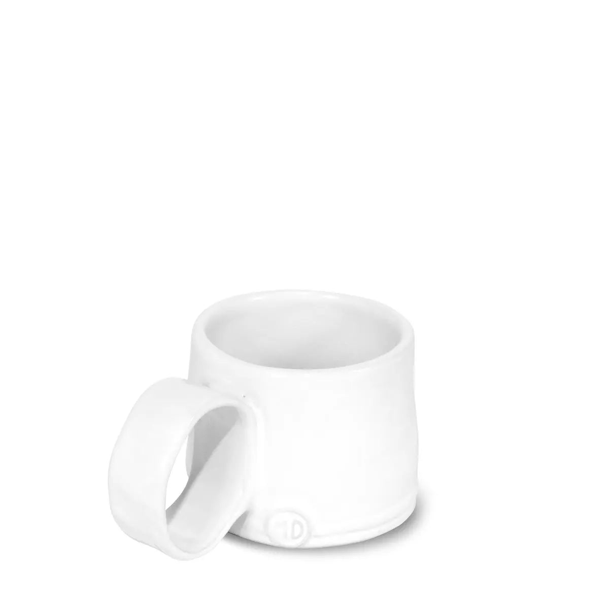 The Montes Doggett Espresso Cup NO. 926 is a white high-fired ceramic mug with a large round handle, smooth minimalistic design, small circular mark near the base, and is dishwasher safe, shown on a plain white background.
